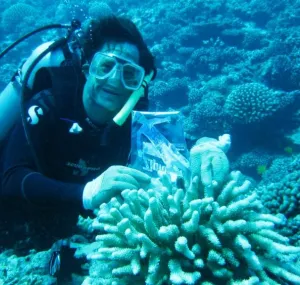 Chris Meyer Scuba diving with a coral head. 
