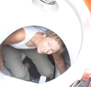 Trish Mace peeks out from a submersible. 