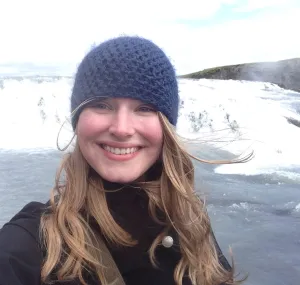 Katherine Drews standing in front of an icy landscape.