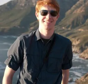 Matt Dozier with coastline behind him.