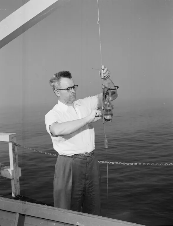 a scientists conduct and experiment on a ship