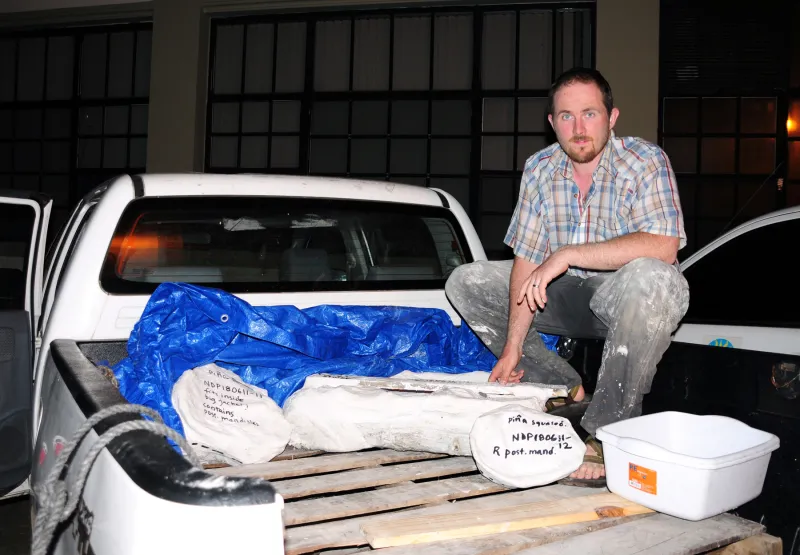 A Smithsonian scientist with a whale fossil he excavated