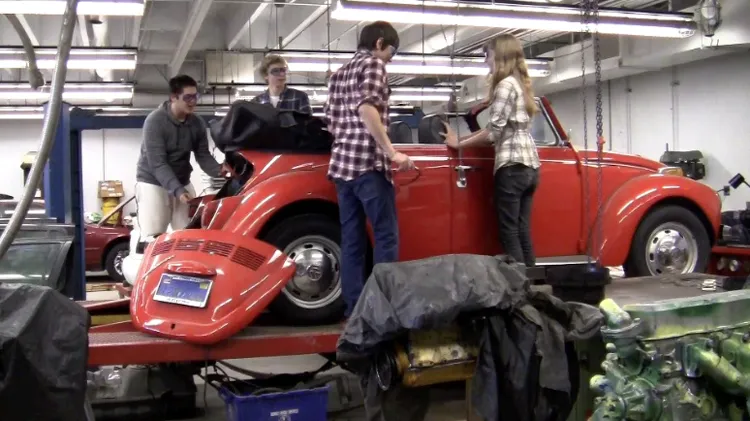 Students studying climate change create an electric car.