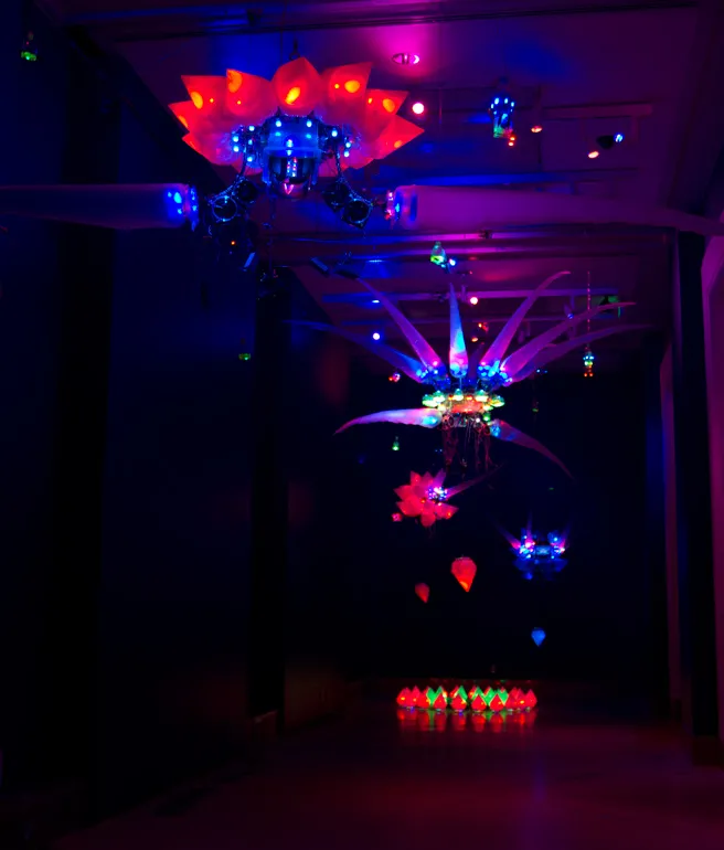 A photo of a 2011 installation by artist Shih Chieh Huang, featuring his illuminated creations made from everyday objects.