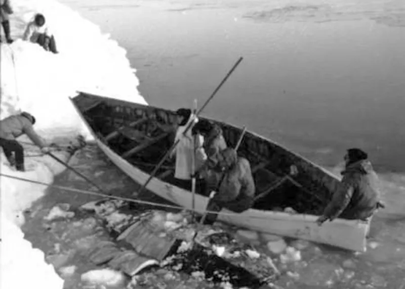 eskimos land a skin boat in the ice