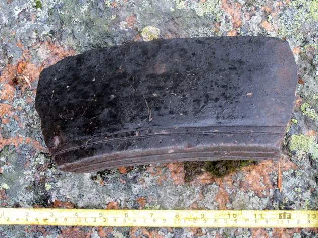 a seven inch fragment of an Inuit soapstone pot recovered at Hare Harbor in Quebec, Canada