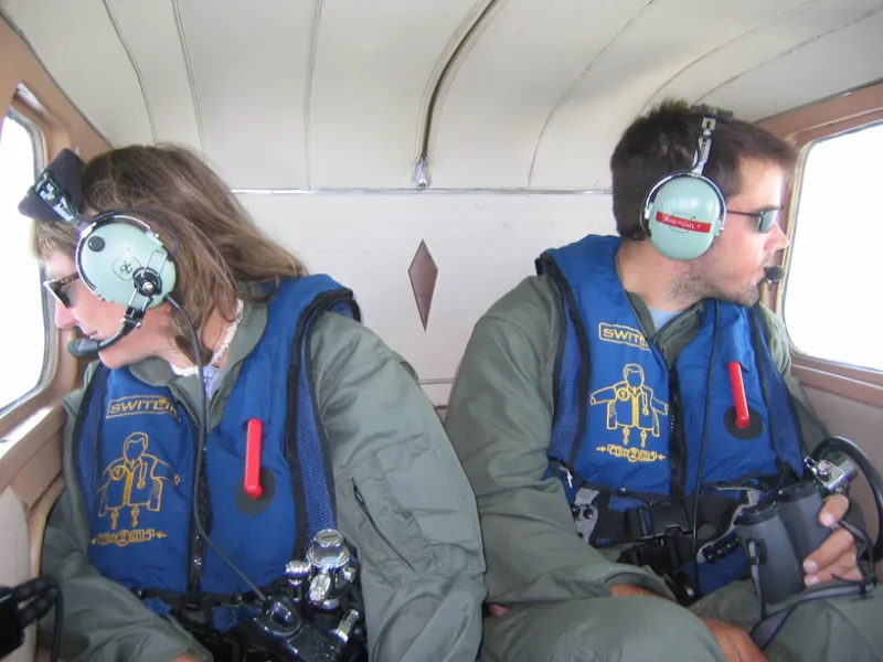 New England Aquarium researchers Dr. Moira Brown and Yan Guilbault conducting aerial surveys for North Atlantic right whales over the Roseway Basin, Canada.