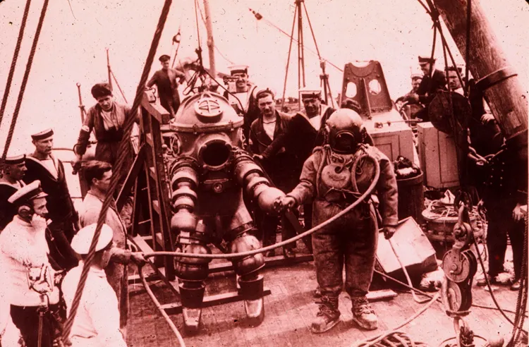 Two divers prepare to explore the Lusitania shipwreck in 1935.
