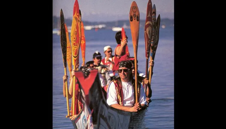 Members of the Squamish Nation paddle to a 1997 festival celebrating Native canoe arts.