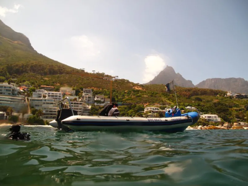 A boat with divers in Clifton Cove