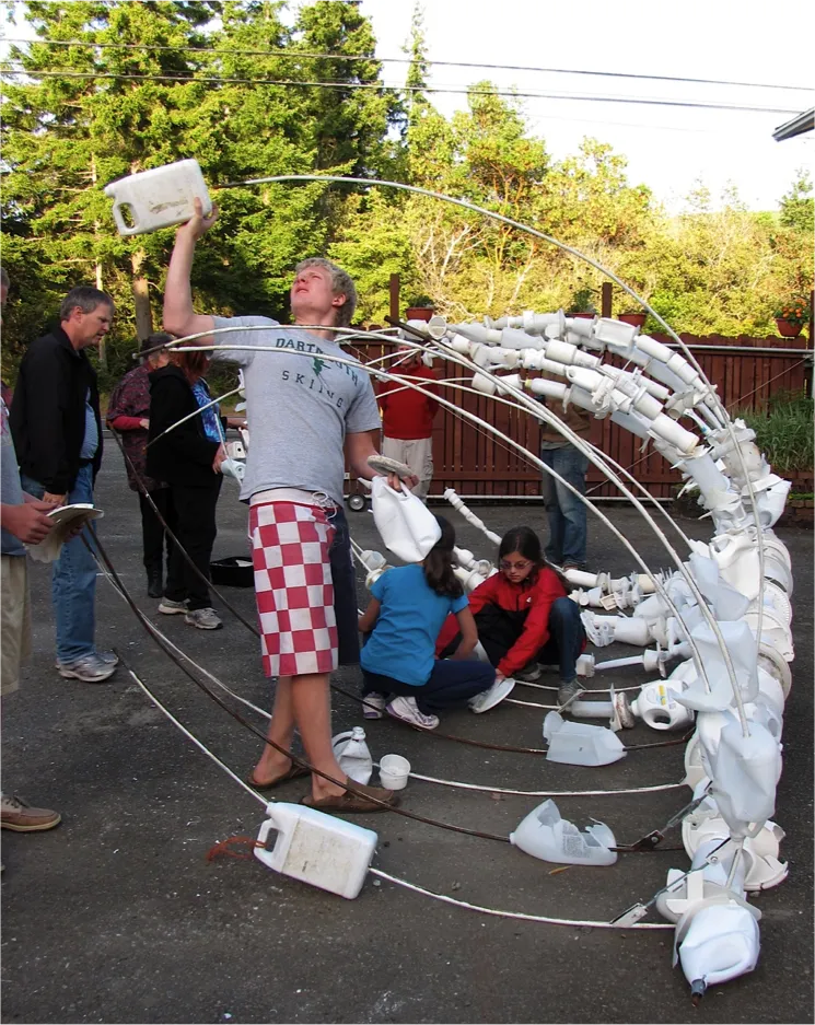 After collecting, cleaning and sorting the plastic, the community came back together to construct the whale ribcage.