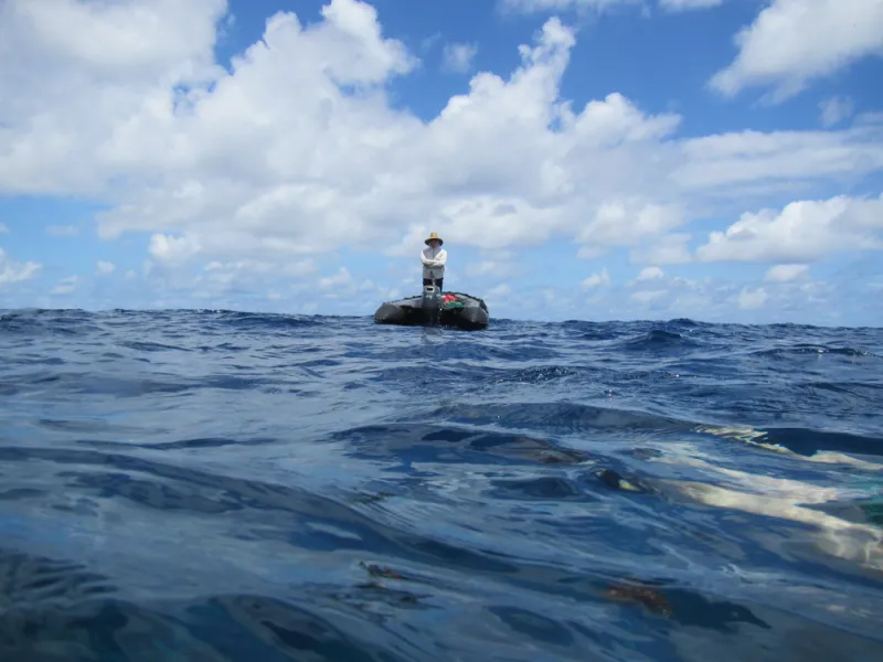 A dive safety officer keeps a close eye on divers from the surface. 