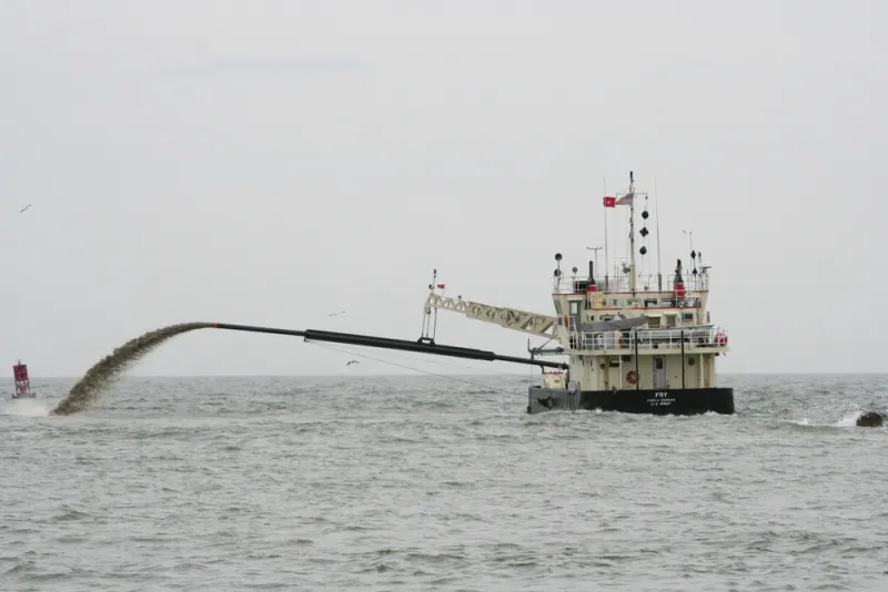 A dredge from the U.S. Army Corps of Engineers can be seen removing a sandbar off of Virginia Beach, VA.