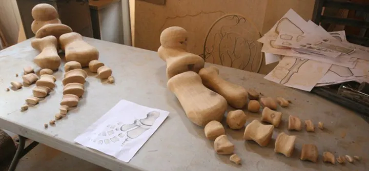 Carved flipper bones made of wood.