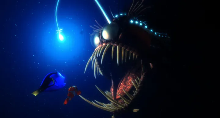 Dory and Marlin encounter a hungry anglerfish in the animated feature film, Finding Nemo. Credit: Pixar Animation Studios&nbsp;
