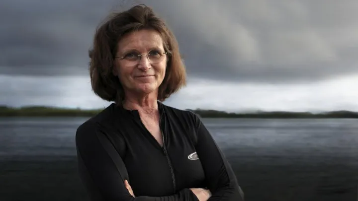 Nancy standing by the ocean