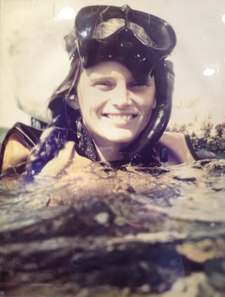 A woman with snorkel gear 