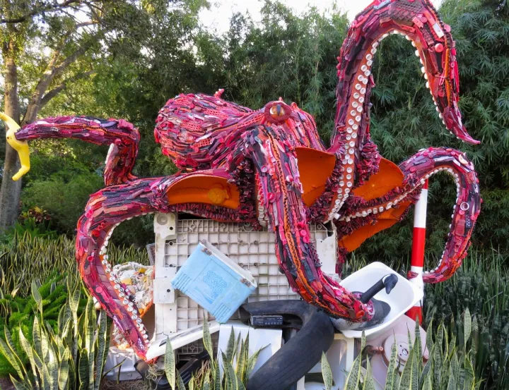 A sculpture of a giant octopus made of ocean debris