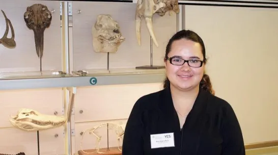 Areli next to collection items at the National Museum of Natural History.