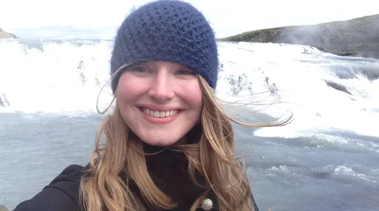 Katherine Drews standing in front of an icy landscape.