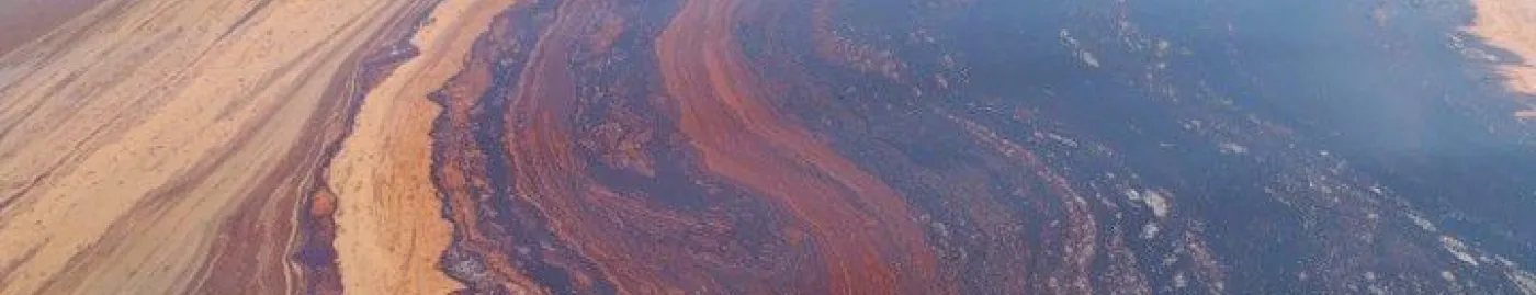 A large oil slick on the sea surface