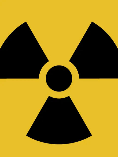 A yellow background with three black shapes in a circle.