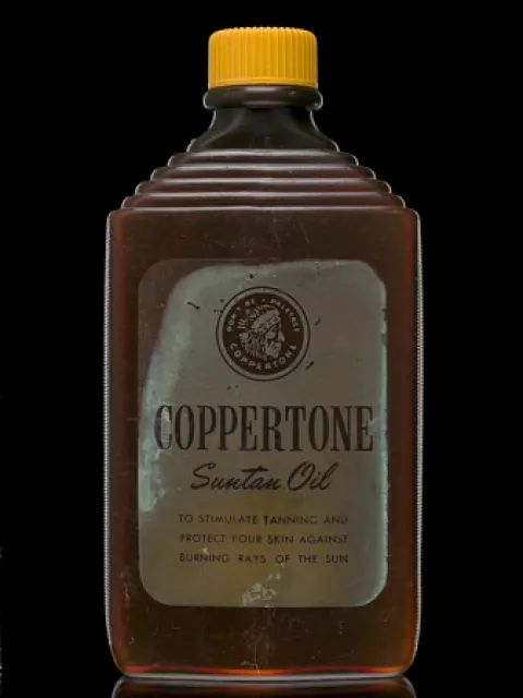 an old bottle of suntan oil