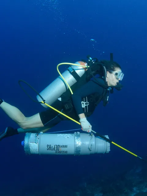 a woman scuba diving