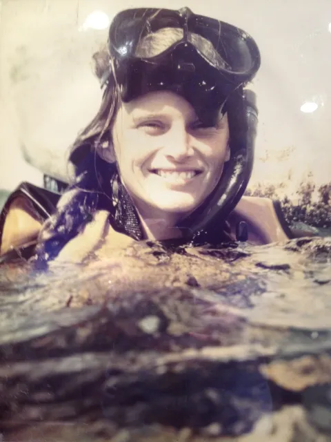 a woman in snorkel gear