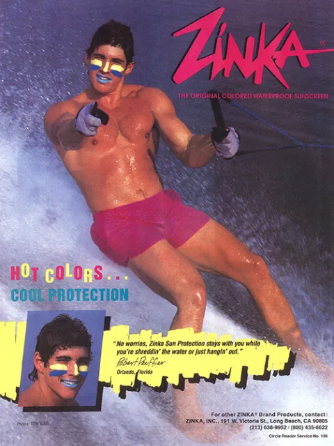 a man waterskis in bright purple swim trunks and colored sunscreen on his face